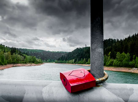 Fantastic shot of a reservoir with a love lock in the foregroundの写真素材