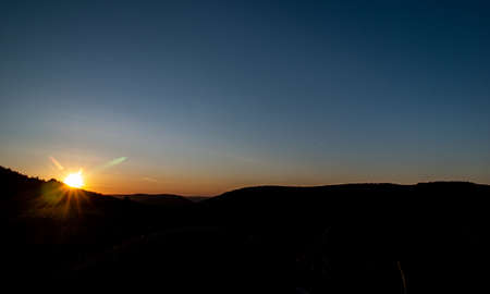 Insanely atmospheric sunrise in the mountainsの写真素材