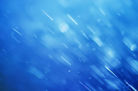 abstract blue bokeh defocused background, falling water dropsの写真素材