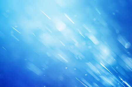 abstract blue bokeh defocused background, falling water dropsの写真素材