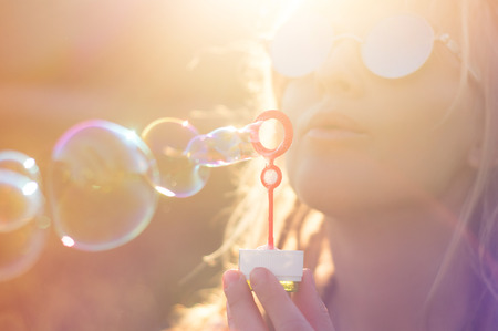 girl, portrait in the summer sun. colorful backgroundの写真素材