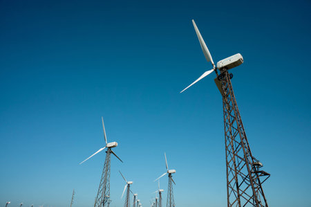 Wind power station - wind turbine against the blue skyの写真素材