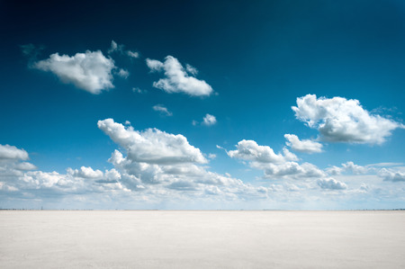 desert landscape with sky and cloudsの写真素材