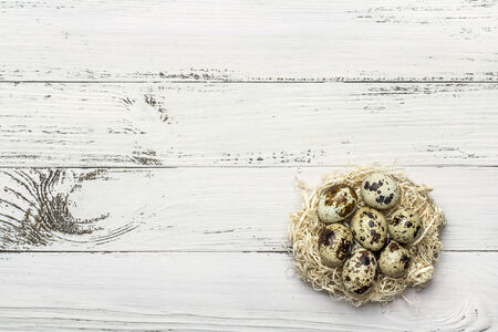quail eggs on white wooden tableの写真素材