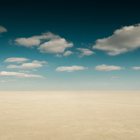 Desert landscape with sky and cloudsの写真素材