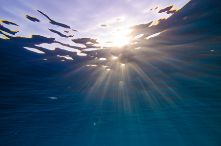 Abstract underwater background with sun rays