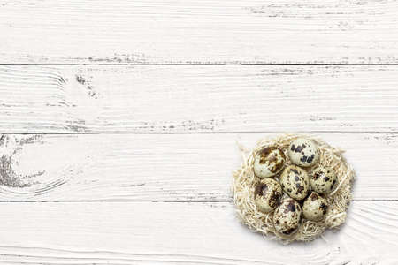 quail eggs on white wooden backgroundの写真素材