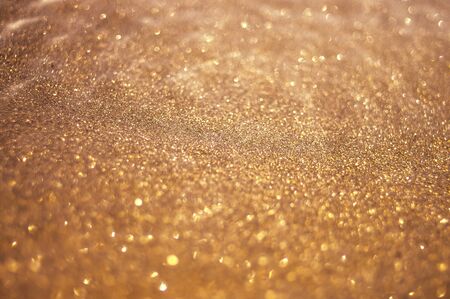 golden sparkle, abstract bokeh backgroundの写真素材