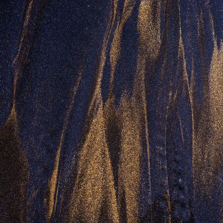 abstract golden and black backgroundの写真素材