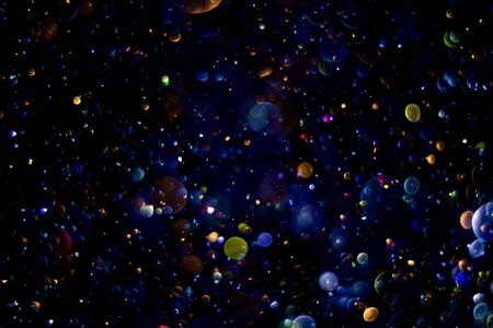 abstract bokeh background, colorful particlesの写真素材