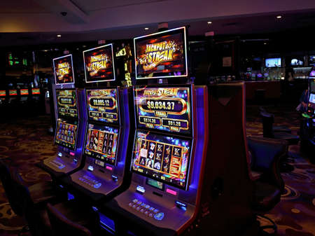Casino machines in the entertainment area at nightのeditorial素材