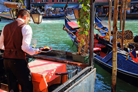 Venetian restaurant terrace near Rialto Bridgeのeditorial素材