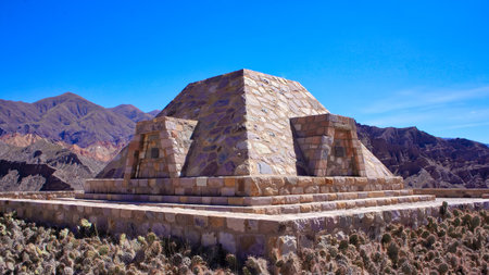 Scenic colorful mountains of Quebrada de Humahuaca and ancient ruins of Tilcara village in Argentinaの写真素材