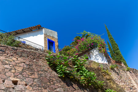 Mexico, Scenic Taxco cobblestone streets in historic city center near Santa Prisca churchの写真素材