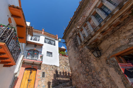 Mexico, Scenic Taxco cobblestone streets in historic city center near Santa Prisca churchの写真素材