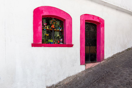 Mexico, Scenic Taxco colonial architecture and cobblestone narrow streets in historic city center near Santa Prisca church.の写真素材