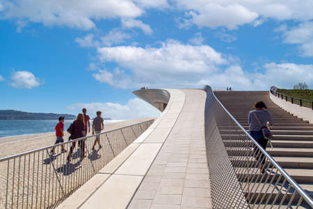 Lisbon, Portugal-October 17, 2020: Observation deck near Belem overlooking landmark suspension 25 of April bridge over Tagus River in Lisbonのeditorial素材