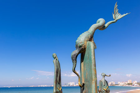 Puerto Vallarta, Mexico-20 April, 2021: Famous Puerto Vallarta sculptures on a scenic ocean boardwalk (El Malecon), a popular tourist destinationのeditorial素材