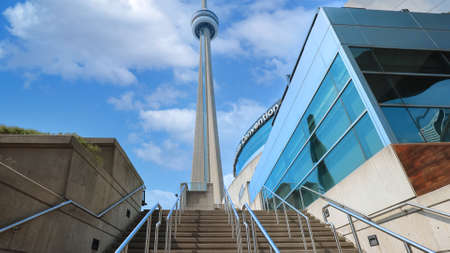 Toronto, Canada-5 May, 2021: Scenic CN Tower overlooking Ontario Lake. A panoramic view from the base of the tower to the top observation deck and Skypod lookout.のeditorial素材