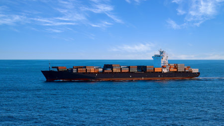 International commerce container cargo ship delivering freight shipment across the ocean.の写真素材