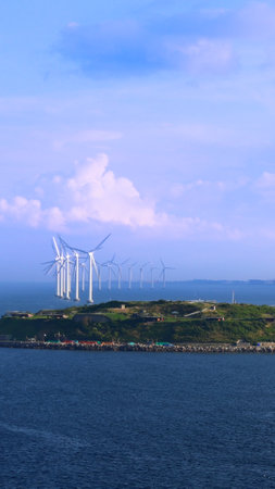 Renewable energy wind power plant and wind turbines along Denmark sea shoreline near Copenhagen.の写真素材