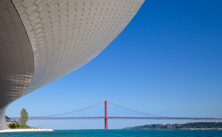Lisbon, Landmark suspension 25 of April bridge over Tagus reiver near Belem tower.