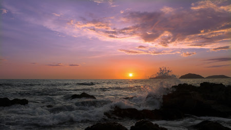 Mazatlan beaches, sunsets and scenic slow motion ocean swells and waves near Malecon sea promenade.の写真素材