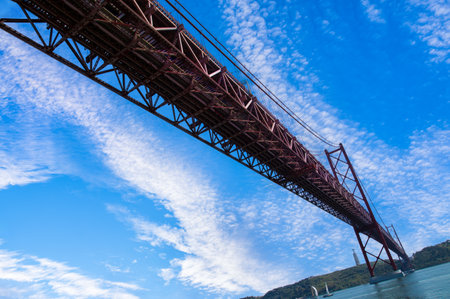 Lisbon, Landmark suspension 25 of April bridge over Tagus reiver near Belem tower.