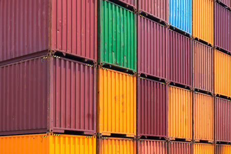 Busy international industrial port with freight and shipment docks and cargo containers.の写真素材