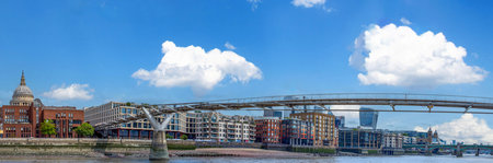 UK, London. Millennium Bridge and Downtown financial business district panorama skylineの写真素材