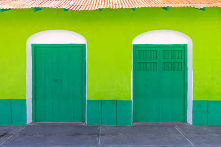 Colorful colonial architecture of historic center of Flores, Guatemalaの写真素材