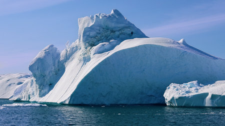 Boat excursion near icebergs of Kangia Fjord and Sermeq Kujalleq glacier in Ilulissat, Greenland