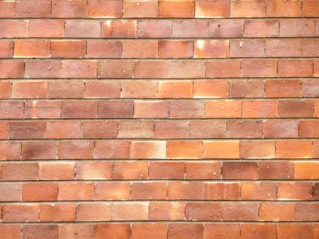 Brick wall of orange stoneの写真素材