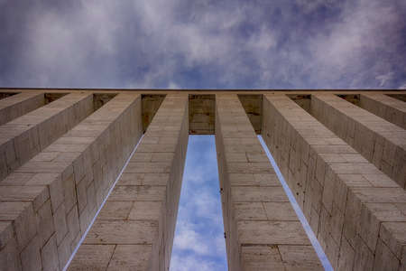 set of columns viewed from below against sky HDRの写真素材