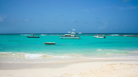 Boats on beautiful turquoise sea in Barbadosの写真素材