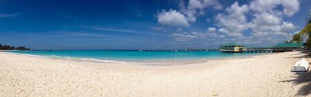 Panoramic tropical beach with white sand and turquoise seaの写真素材