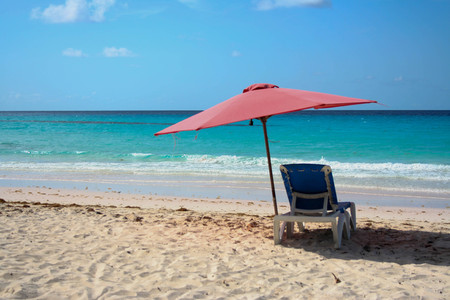 One Lounge with umbrella in tropical beach of Barbadosの写真素材