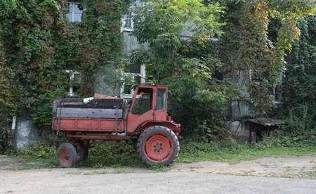 red tractor on green landscapeの写真素材