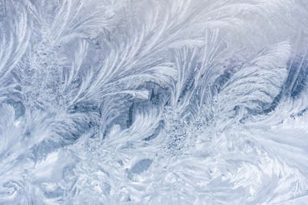 Frosty pattern on window in winter seasonの写真素材