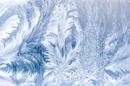 Frosty pattern on window in winter seasonの写真素材