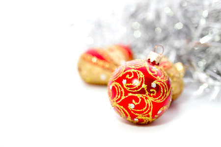 Closeup of red Christmas balls heart and on white backgroundの写真素材