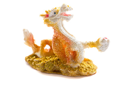 feng shui golden chinese dragon of the lucky sculpture isolated on white backgroundの写真素材