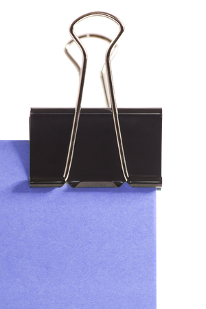 close-up black clip and purple post note isolated on pure white backgroundの写真素材