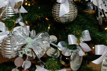 silver and white Christmas and New Year tree decorationsの写真素材