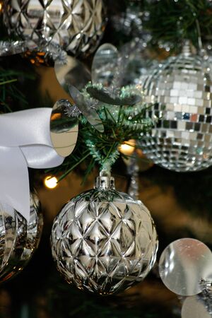 silver and white Christmas and New Year tree decorationsの写真素材