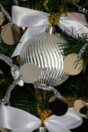 silver and white Christmas and New Year tree decorationsの写真素材