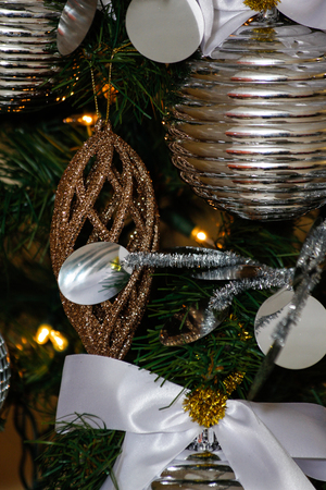 silver and white Christmas and New Year tree decorationsの写真素材
