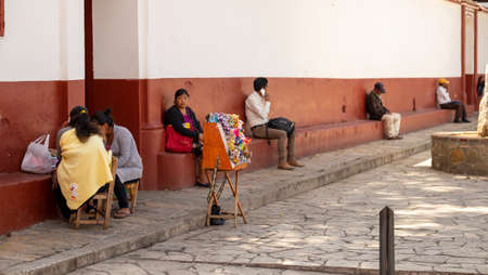 San Cristobal de las Casas, Chiapas, Mexico - March 13rd, 2018: local people sit at the squareのeditorial素材