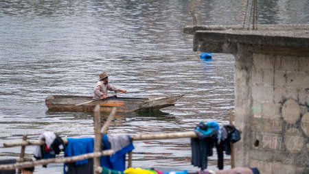 San Pedro La Laguna, Guatemala - May, 23rd, 2018: lake Atitlan with fisherman on canoeのeditorial素材