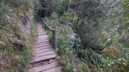 Wooden board walk down to El Silencio waterfall in Colombia
